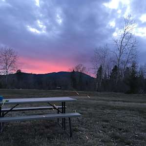 Beautiful sunset with a fire in the evening.