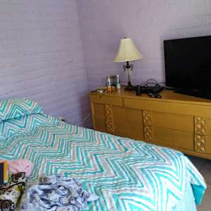 Comfy Queen bed with its own blu-ray and smart tv!