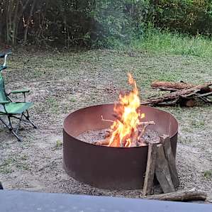 Spacious site with a nice picnic table and fire ring