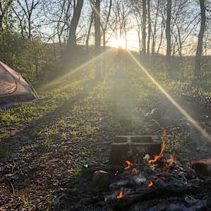 Enjoying a campfire as the sun sets