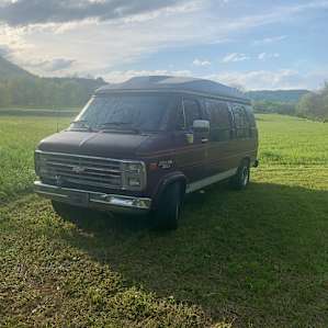 Our chariot and home away from home Luna, basking in the meadow
