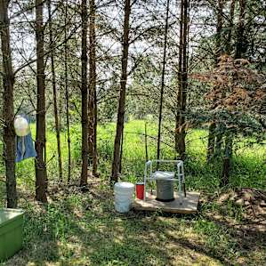 Camp toilet with TP, sawdust and hand washing supplies available.