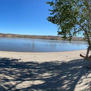 Lahontan Reservoir is an easy 10 min hike (more like walk) away. Has a beach.