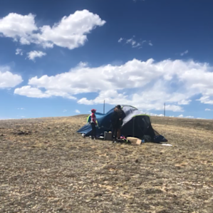 Very top of the hill.