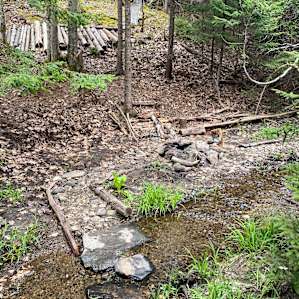 enterring into the campsite across a small stone bridge
