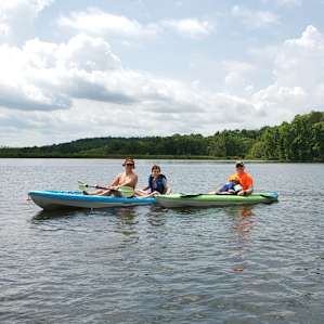 Great lakeside beach with clean sandy bottom and a gentle slope to access for swimming and floating.