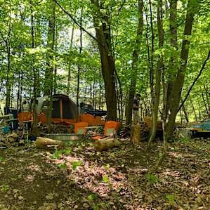 Our tent is Huge (11 person). We had to clear some space but it fit and we still had room for cooking area and seating. This is pond site.