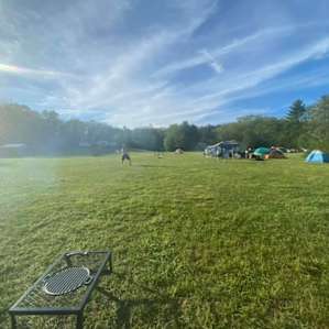 A sunny day at camp playing some ball in the feild