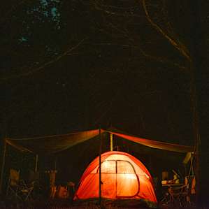 There were storms incoming in the night, so for added dryness we set up a tent under this tarped area. (There are also chairs and tables over here)