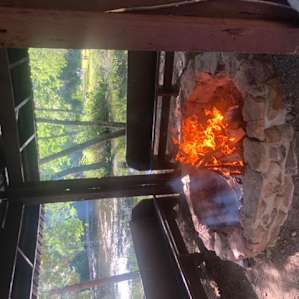 The fire pit looking out over one of the ponds and the meadow behind.