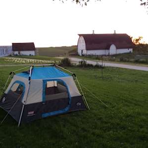 Our chosen campsite on some flat ground near the path leading into the building.