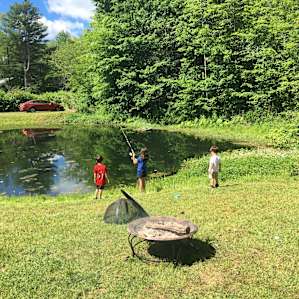 The kids fishing in the trout lake.
