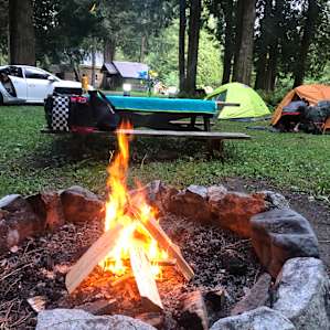 Large site with plenty of room for tent setup, area to park your vehicle, and well-structured firepit.