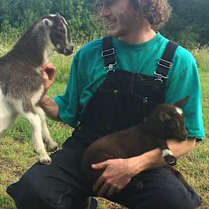 The bday boy cuddling with goats! A birthday dream!