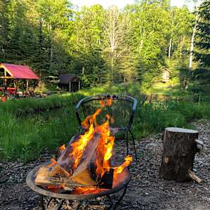 Looking at the pond and community fire pit from Danny’s Tent