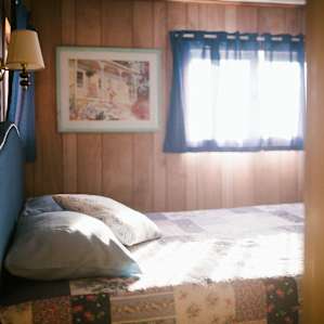 First bedroom with a large wardrobe.
