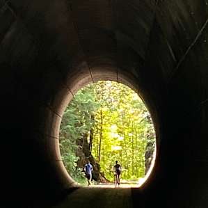 The view out of a long Tunnel on the Lamoille Valley Rail trail