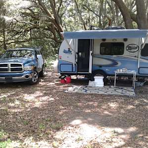 Cool and shady campsite under Spanish moss-draped oaks.