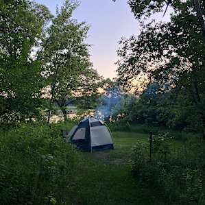 Our setup in the mowed circle at the back of the property. Quiet and private with a nice view of the water.