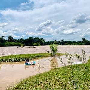 Due to recent storms, the river was high and flowing very quickly during our visit. We were able to safely float in a slow-moving area off to the side. Patti told us that the river level is usually lower and safe to swim in.