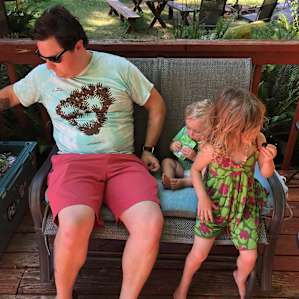 Family sitting on the lovely little deck overlooking the river