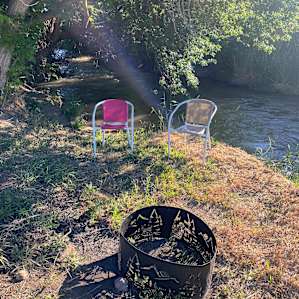 Seating right by the creek, just feet away from your RV spot.