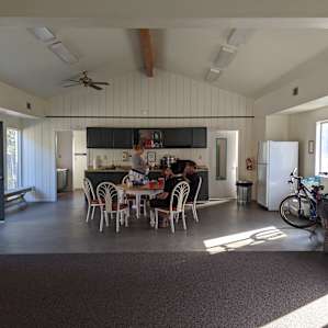View from the great room to the full kitchen with full bathrooms off both sides.