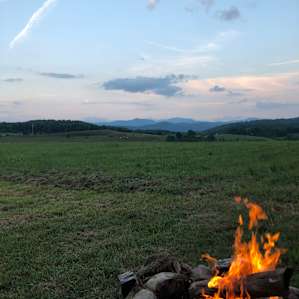 Enjoying a camp fire, facing the Green Mountains.