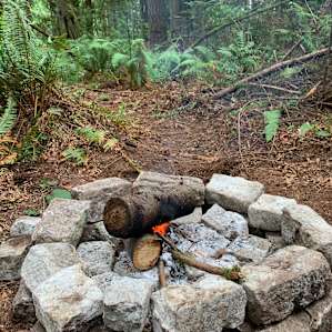Freshly made fire pit on the new campsite