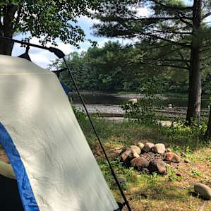 pitched our tent in a shady & grassy area right next to the river, but there are plenty of other spots to do so.