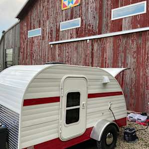 Parked by the barn.