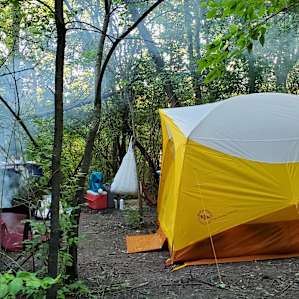 This is a pretty good idea of what camp looks like all set up. It's cozy. Some of my other pictures use a wide-angle lens which may make things appear more spread out. Overall, there's still *plenty* of space to be comfortable!