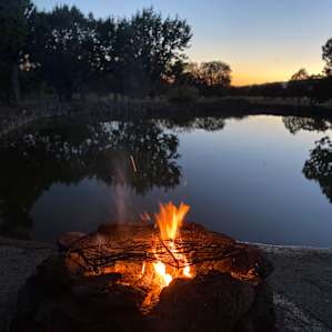Enjoying wine by the pond
