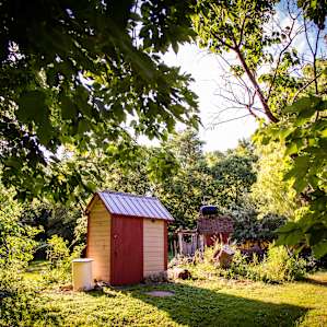Next to the bathroom is a solar shower!