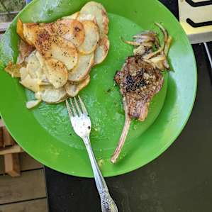 Lamb rack we purchased at 7U made with a garlic butter sauce, caramelized onions, and scalloped potatoes.
