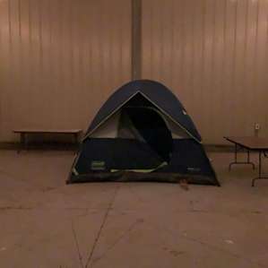 Sheltered from the cool night breeze in a open barn