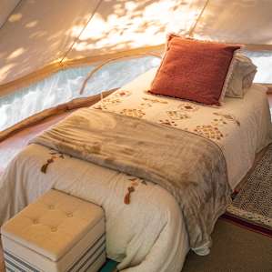 A soft and comfy bed awaits after a long day of exploring the area.