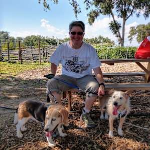 Sitting on the picnic table outside the orchard.