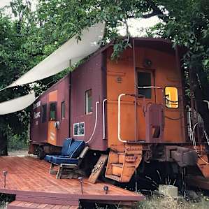 Their super cool tiny house train caboose available for rent!