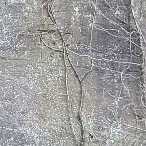 dates carved into the quarry wall