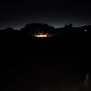 camp from pond at night