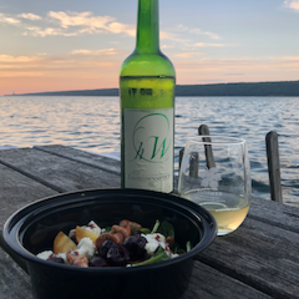 Enjoy FLX wine, food and sunset from the dock.