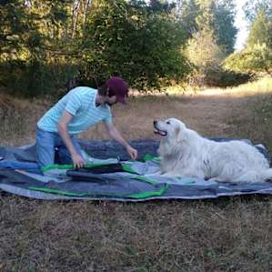 Snowflake helping us set up our tent.