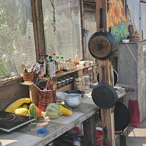 All of the dish and cookware you need, with a bonus cabinet for dried goods. (Take what you need, leave what you don't!)