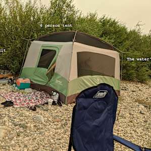 The least-rocky site by the water is also very close to the water's edge. Tent is a Eureka 6-person tent for scale.