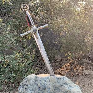 A sword in a stone. I think it's a real sword. It has some weight to it. I was strong enough to pull it out but I have no dragons to slay so I returned it.