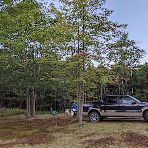 We stayed in their side yard rather than in the woods, but parks sideways to give us a little privacy