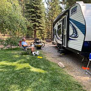 RV Spot in the Forest with a Pond