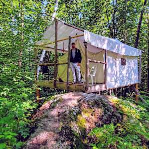 Tent House on stilts. Cute patio area to chill. Check out the rock formation steps! All natural!