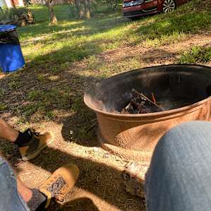 Campsite has a fire pit and a fire pit grill